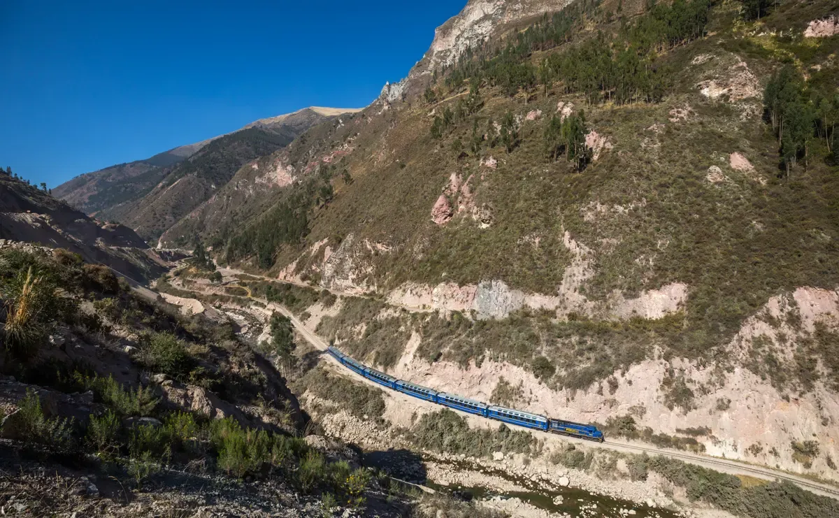 A PeruRail train in the valley between Poroy and Ollantaytambo, on the Salkantay trek route